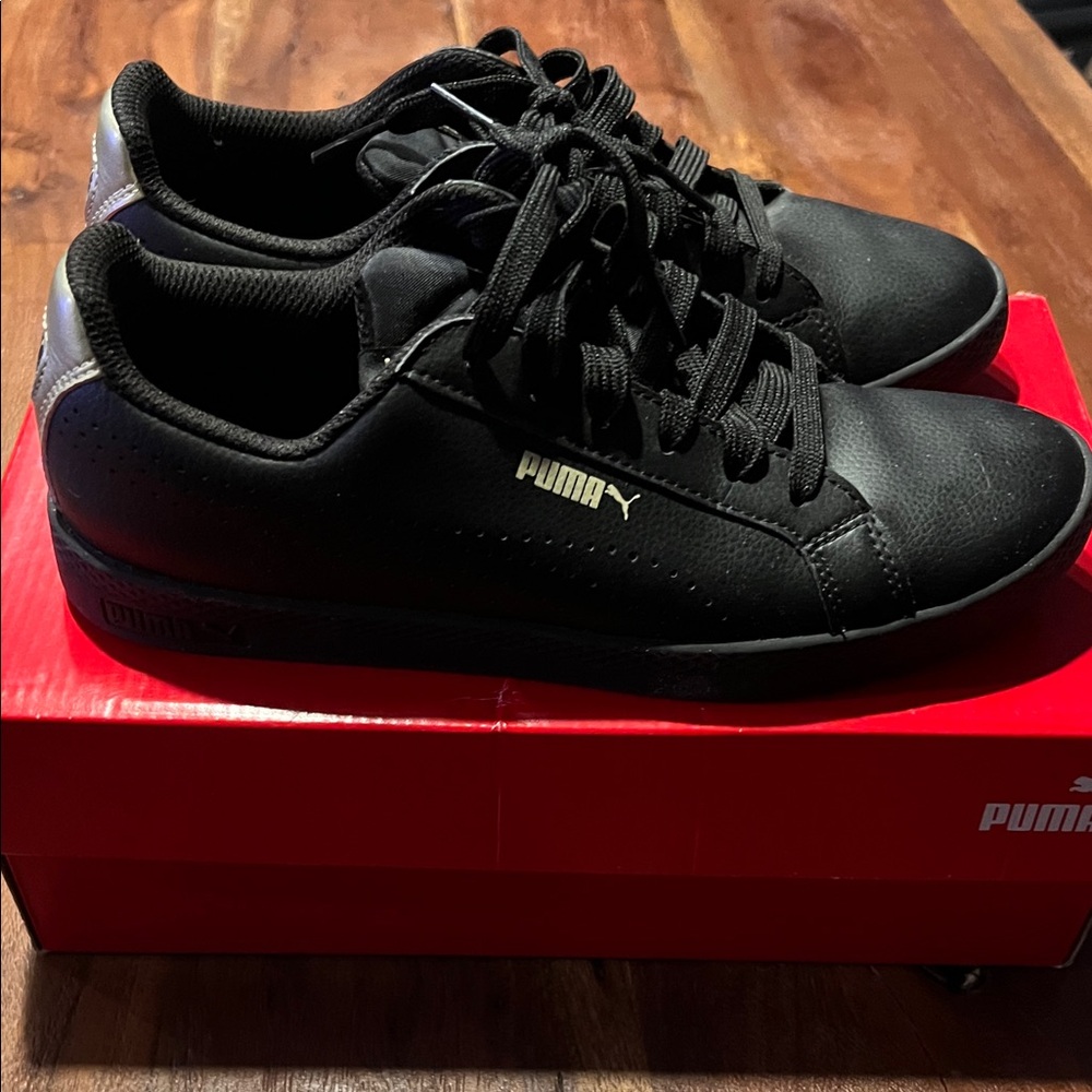 Puma Women’s Black and Gold Sneakers